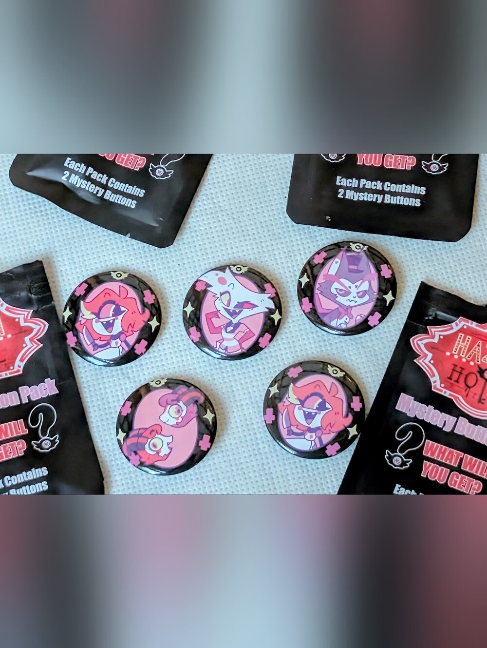 Hazbin Hotel Official Mystery Button Pins from Hot Topic Husk Angel Niffty